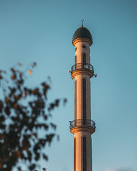 Low angle view of bell tower against sky