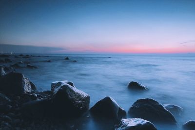 Scenic view of sea against sky at sunset