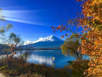 Scenic view of lake against sky during autumn