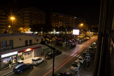 High angle view of traffic on city street at night