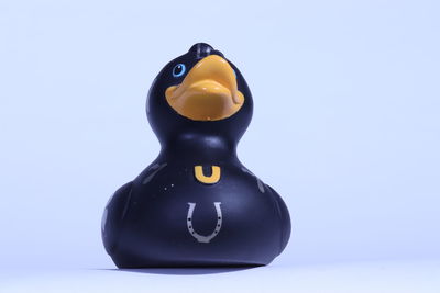 Close-up of a toy over white background