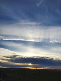 Scenic view of land against sky during sunset