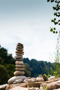 Stack of pebbles against clear sky