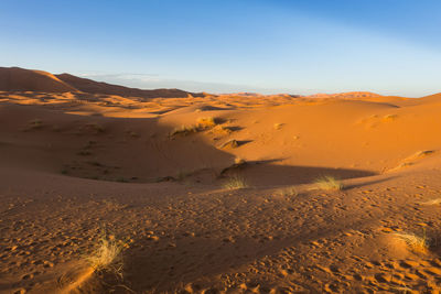 Scenic view of desert against clear sky