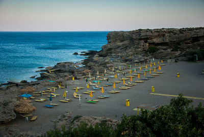 Scenic view of lounge chairs o beach