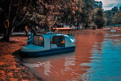 Boat in park by lake