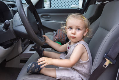 Boy sitting in car