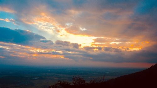 Low angle view of dramatic sky during sunset