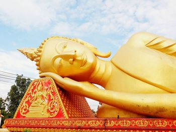 Low angle view of statue against sky