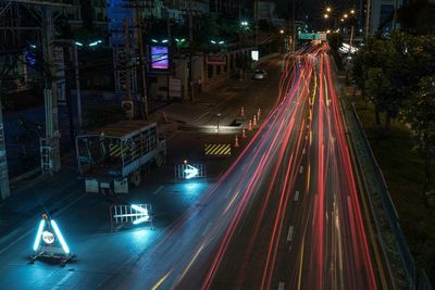 High angle view of light trails on road at night