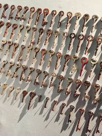 Various keys hanging on wall