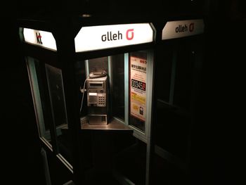 Information sign in illuminated room at night