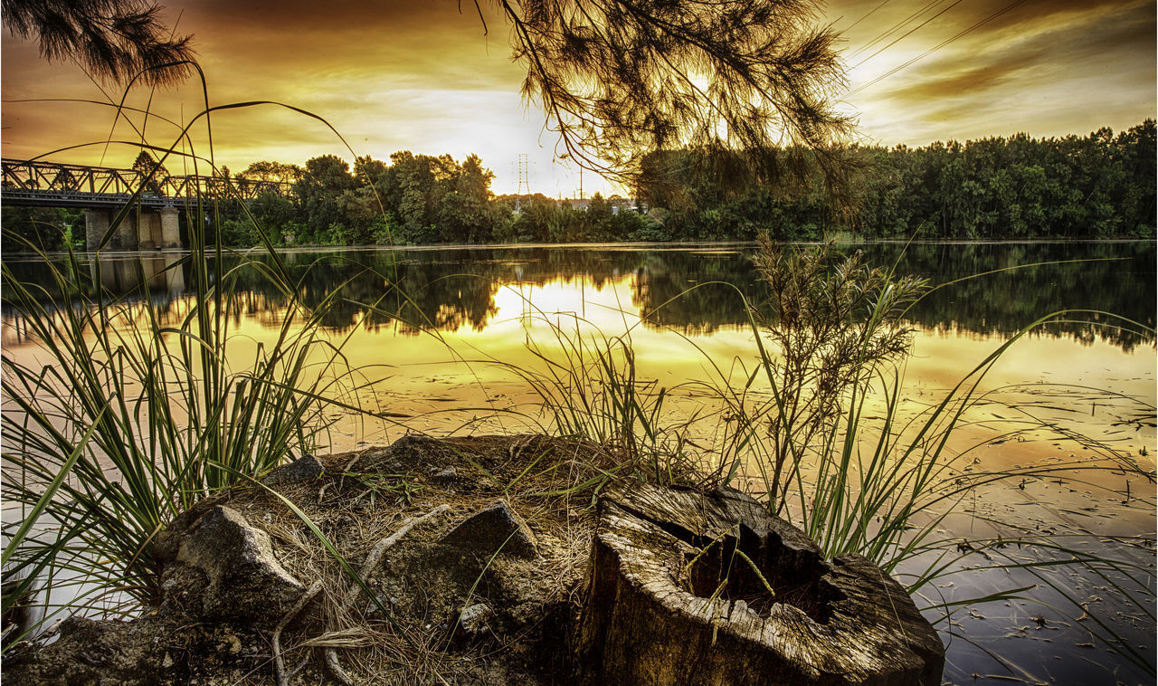 SCENIC VIEW OF LAKE DURING SUNSET