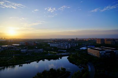 Aerial view of city at sunset