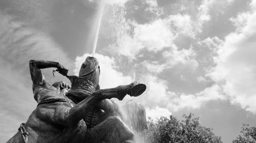 Low angle view of statue against sky