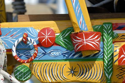 Close-up of multi colored umbrellas on table