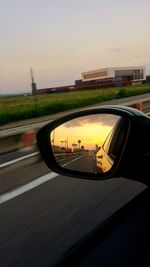 Reflection of sky on side-view mirror