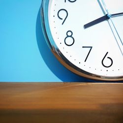 Close-up of clock on table