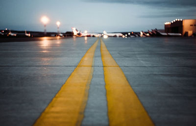 Surface level of road against sky at night