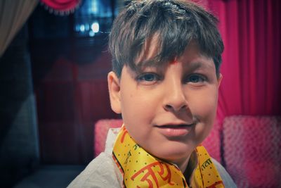 Close-up portrait of smiling boy