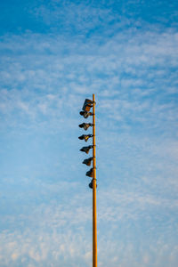 Low angle view of street light against sky