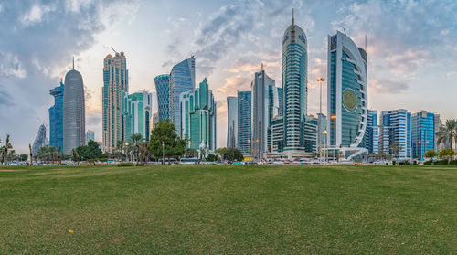 Doha skyline from sheraton park daylight view with clouds in the sky 