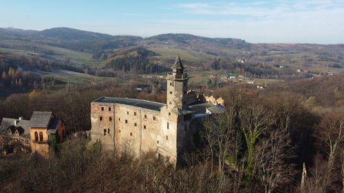 Panoramic view of temple and buildings against sky