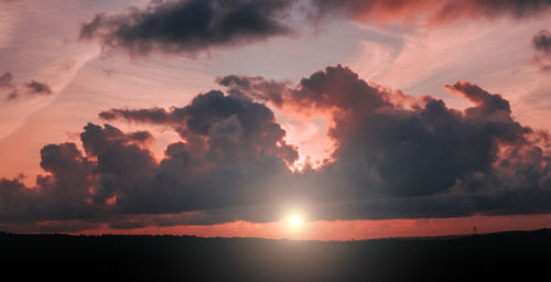 Low angle view of dramatic sky during sunset