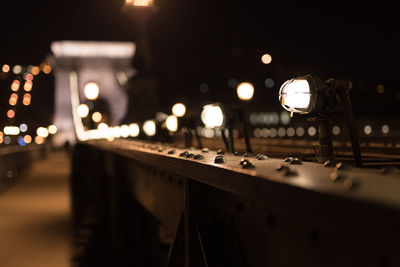 Close-up of illuminated bridge at night