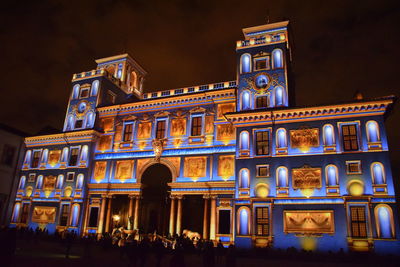 Low angle view of illuminated building at night