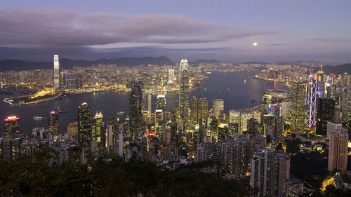 Aerial view of city lit up at night