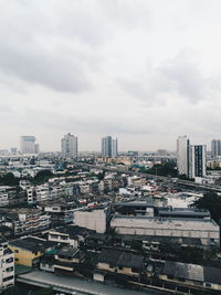 High angle view of buildings in city against sky