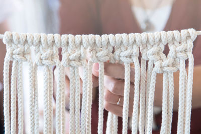 Women hobby knitting handmade macrame.