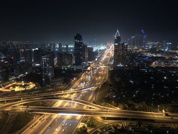 High angle view of illuminated city buildings at night