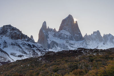 Scenic view of snowcapped mountains against sky