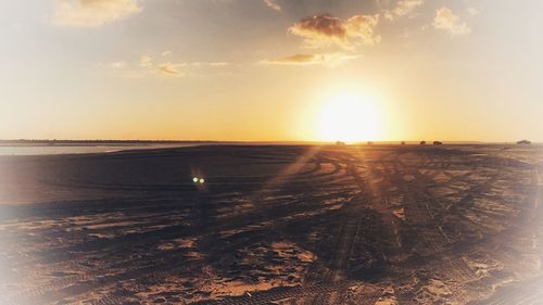 Scenic view of sea against sky at sunset