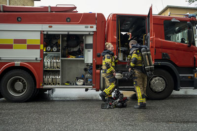 Firefighters in front of fire engine