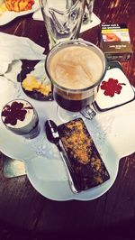 High angle view of cake with coffee on table