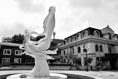 Statue of historic building against sky