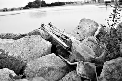 High angle view of old rocks by lake