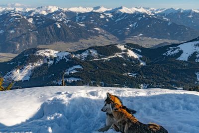 Scenic view of snowcapped mountains covered with snow