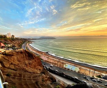 High angle view of beach against sky during sunset