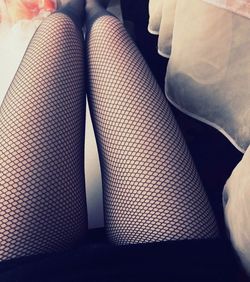 Low section of woman sitting on floor