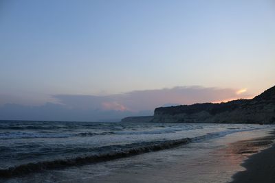 Scenic view of beach against sky during sunset