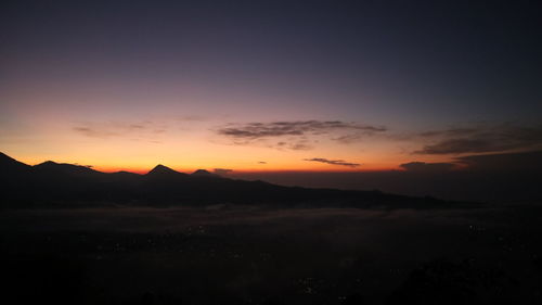 Scenic view of silhouette landscape against romantic sky at sunset