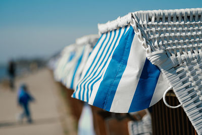 Wicker beach chair in a row at the sea