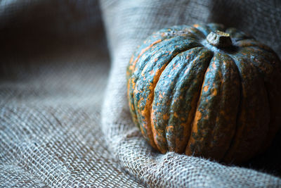 Close-up of pumpkin on burlap