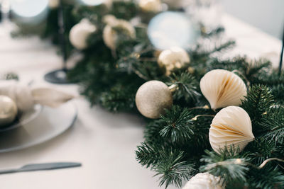 Christmas decor from craft paper on dining table. living room interior. christmas table setting over