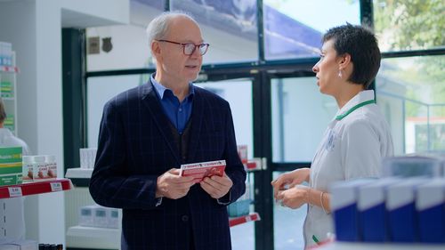 Portrait of businessman using mobile phone