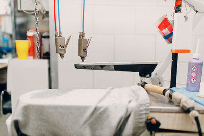 Cropped hand of man cleaning equipment